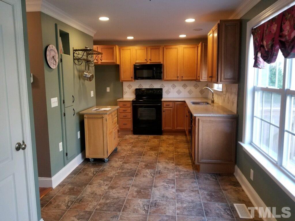 901 Ledgerock Road Wake Forest, NC 27587 - Photo 4 of 23 Updated kitchen w/ solid surface Silestone countertops