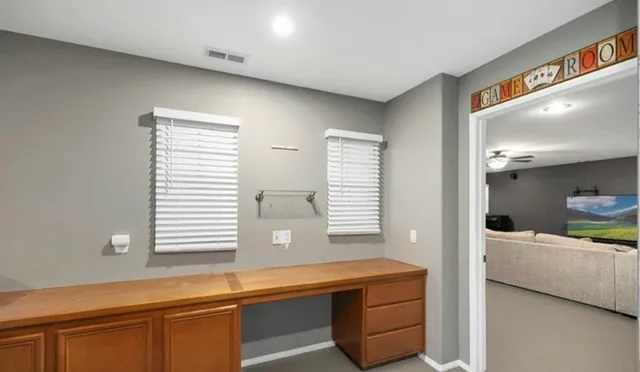 a room with two beds and painted walls