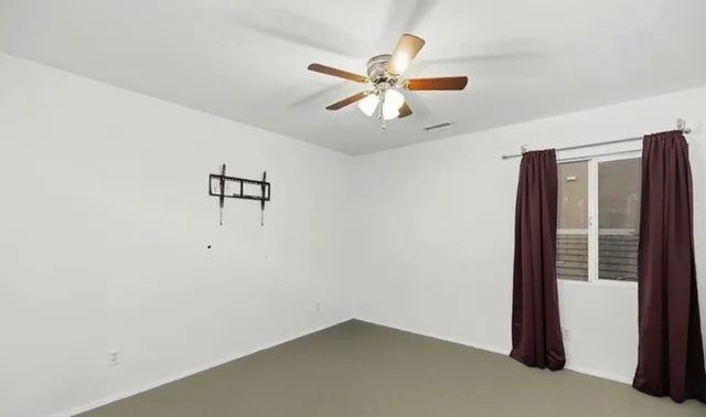a view of a hallway with a fan