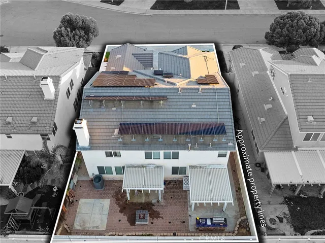 an aerial view of residential houses with outdoor space and river