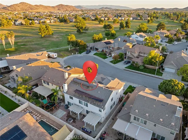 an aerial view of a house with a outdoor space