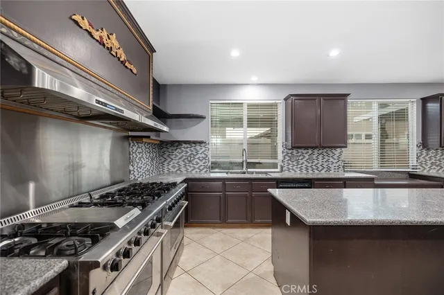 a kitchen with a stove and a sink