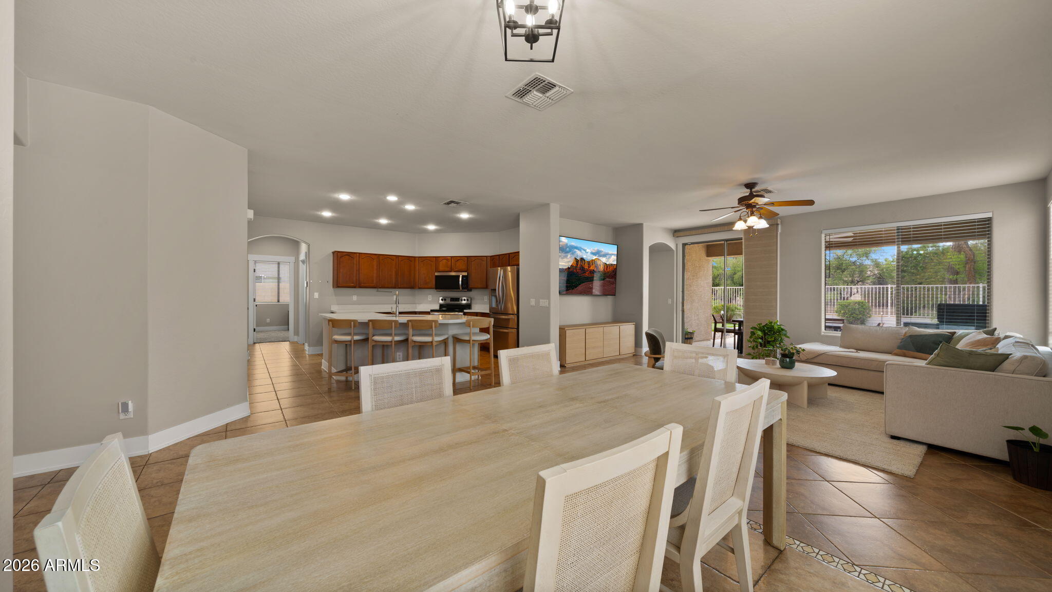 3344 East Hopkins Road Gilbert, AZ 85295 - Photo 9 of 32 a large kitchen with a large window and stainless steel appliances