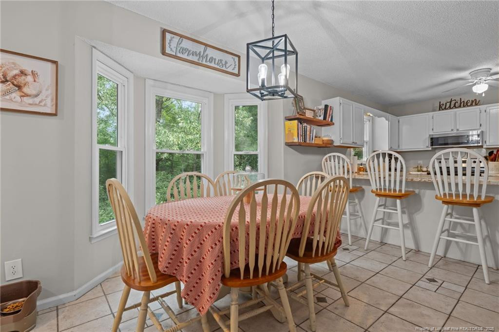 76 North Hillside Drive Spring Lake, NC 28390 - Photo 15 of 50 a view of a dining room with furniture window and outside view