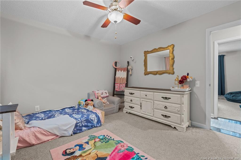 76 North Hillside Drive Spring Lake, NC 28390 - Photo 21 of 50 a bedroom with a bed and a dresser in it