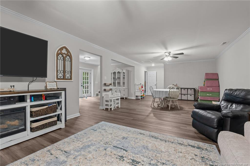 76 North Hillside Drive Spring Lake, NC 28390 - Photo 27 of 50 a living room with furniture and a flat screen tv