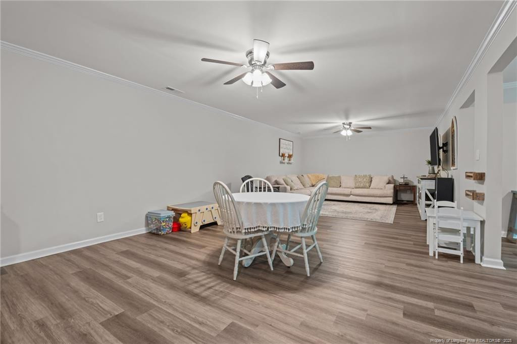 76 North Hillside Drive Spring Lake, NC 28390 - Photo 29 of 50 a living room with furniture and a wooden floor