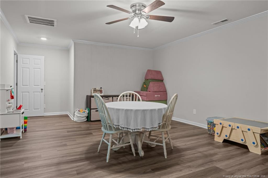 76 North Hillside Drive Spring Lake, NC 28390 - Photo 33 of 50 a view of a dining room with furniture and wooden floor