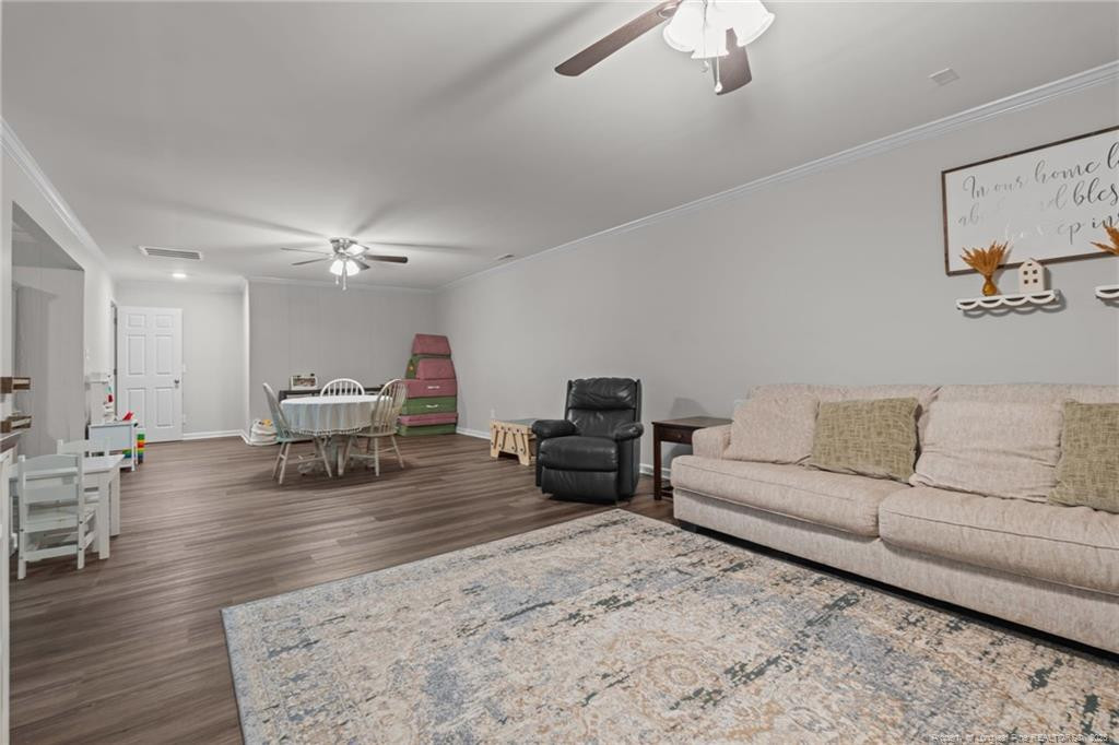 76 North Hillside Drive Spring Lake, NC 28390 - Photo 34 of 50 a living room with furniture and a wooden floor