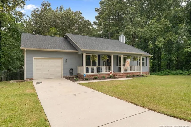 a house with trees in the background