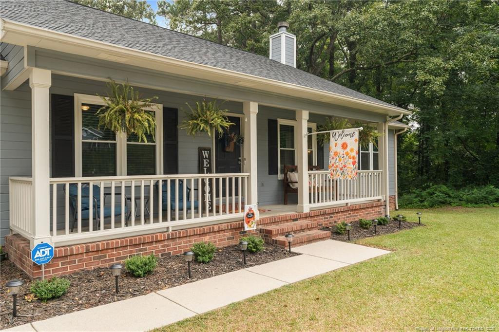 76 North Hillside Drive Spring Lake, NC 28390 - Photo 38 of 50 a front view of a house with a porch
