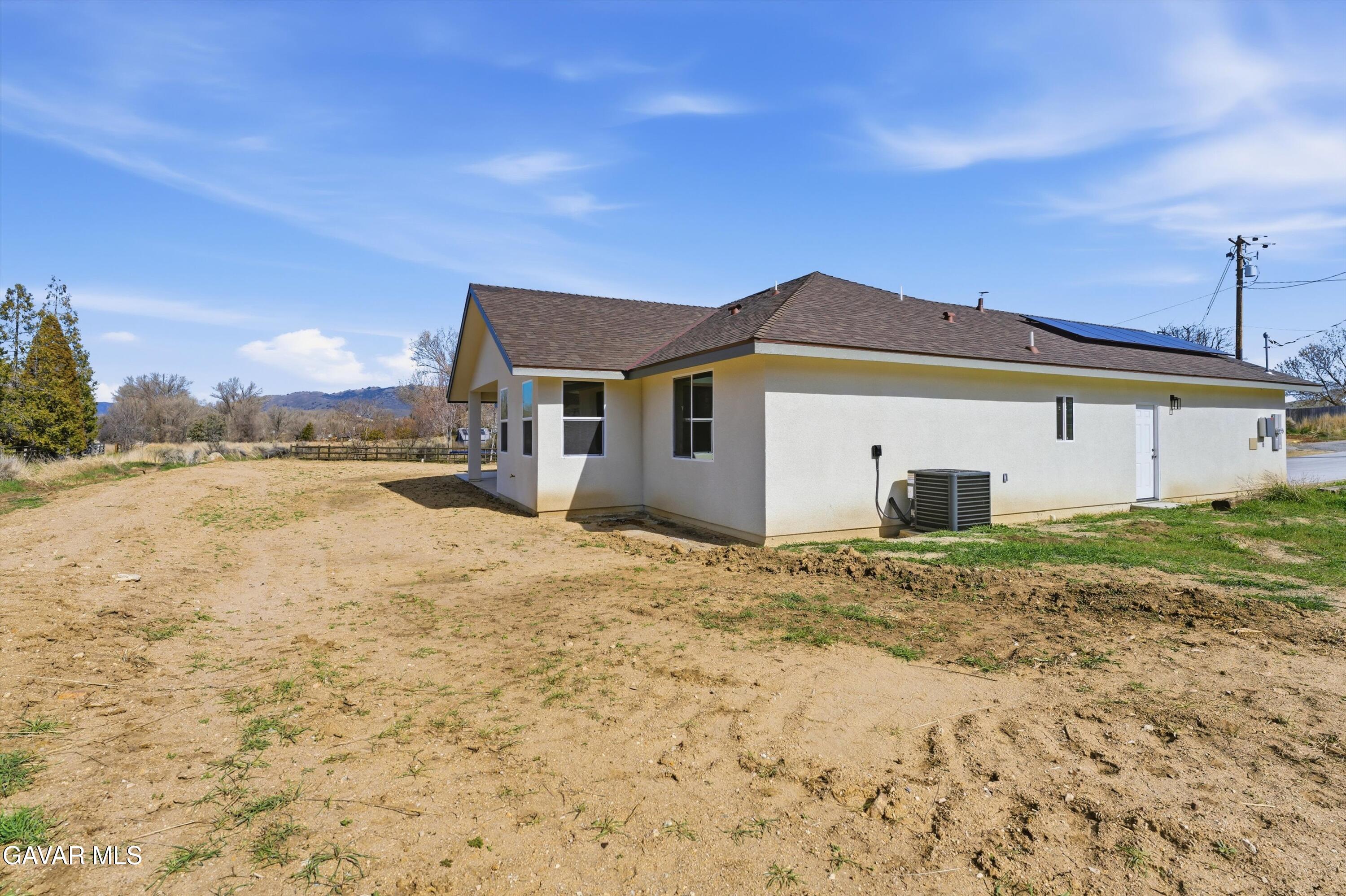 22613 Royal Place Tehachapi, CA 93561 - Photo 21 of 28 a view of a house with a yard
