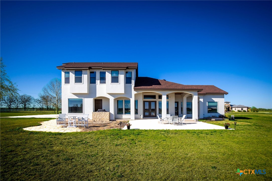 925 River Ranch Circle Martindale, TX 78655 - Photo 5 of 48 a front view of a house with swimming pool having outdoor seating