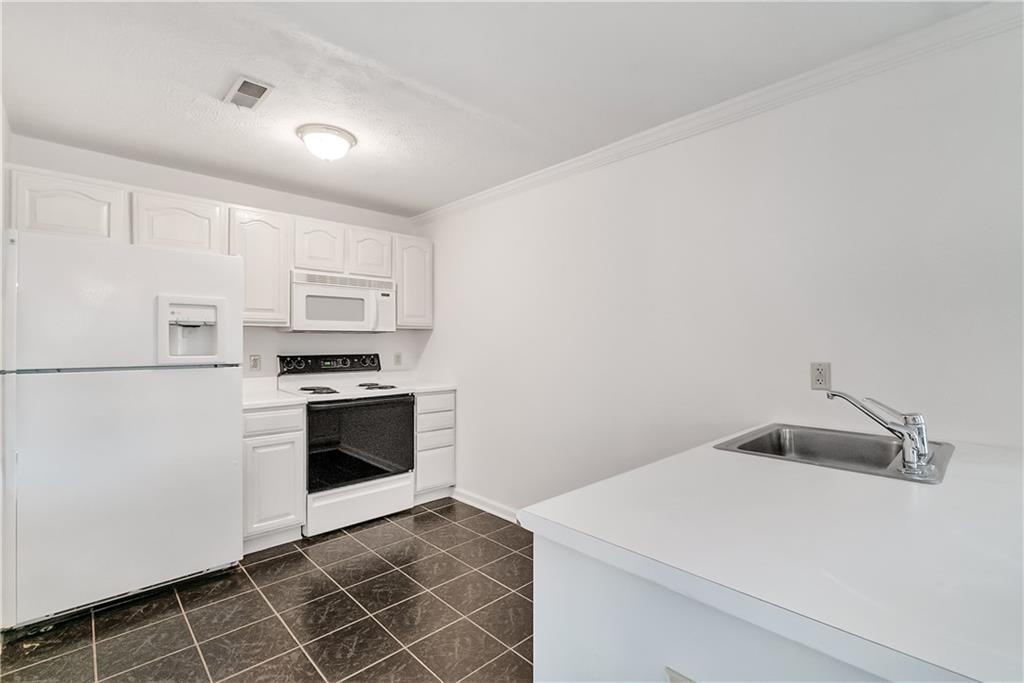 690 Gamble Road Oakdale, PA 15071 - Photo 22 of 24 Full kitchen in finished basement with appliances, stainless sink and cabinets. Ideal for entertaining friends and family.