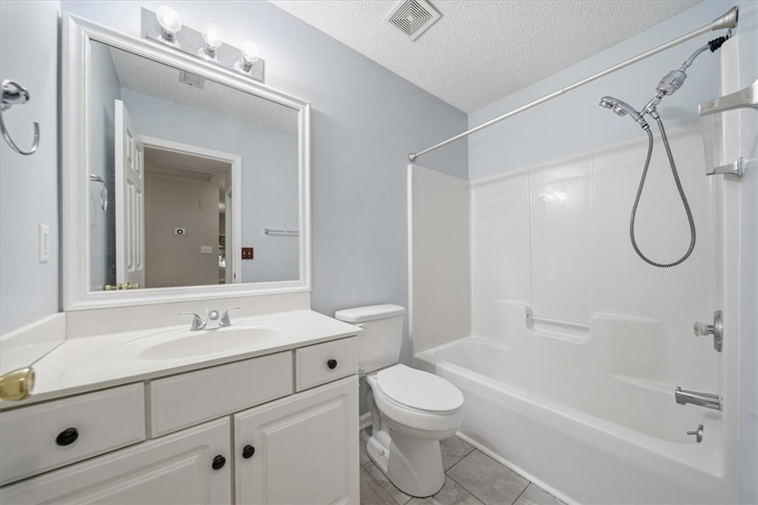 101 Grand Oak Circle Pendleton, SC 29670 - Photo 19 of 40 Well-lit vanity with ample storage and a complete shower-over-tub setup.