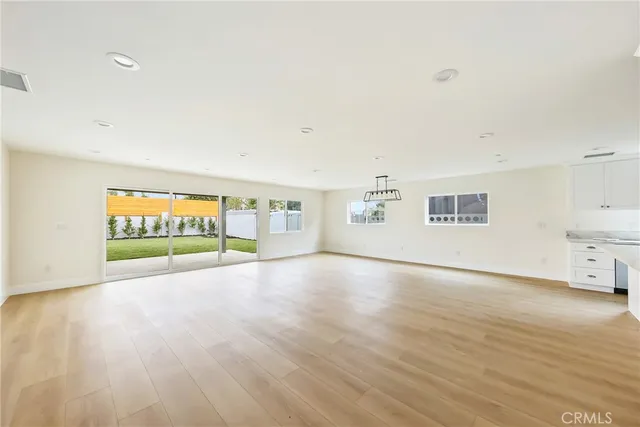 a view of empty room with floor to ceiling window