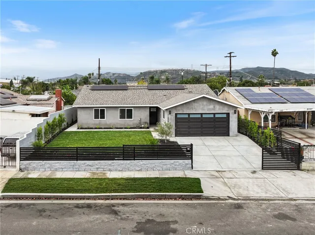 an aerial view of residential houses with city view and wooden floor