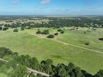 a view of a field with an ocean