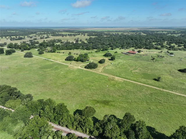 a view of a field with an ocean