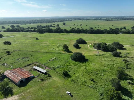 a view of a golf course with an ocean