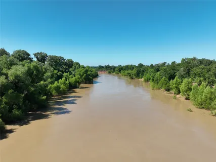 a view of a lake with houses in background