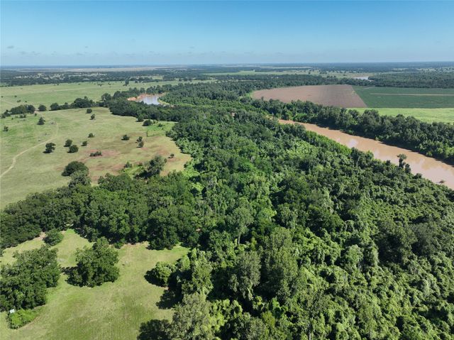 an aerial view of a houses with a lake view