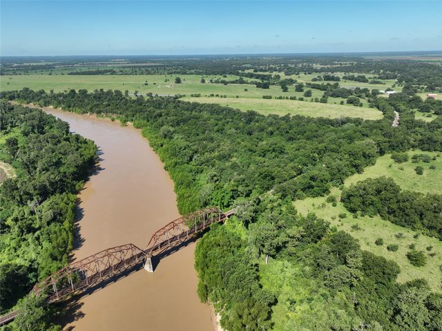 an aerial view of beach and ocean