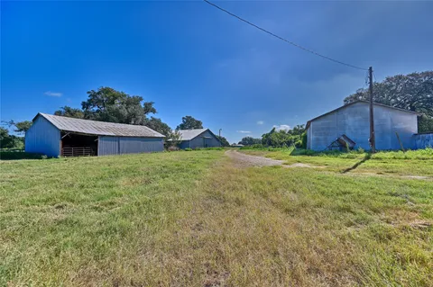 a view of a lake with a yard