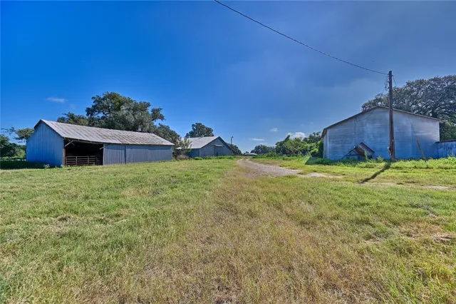 a view of a lake with a yard