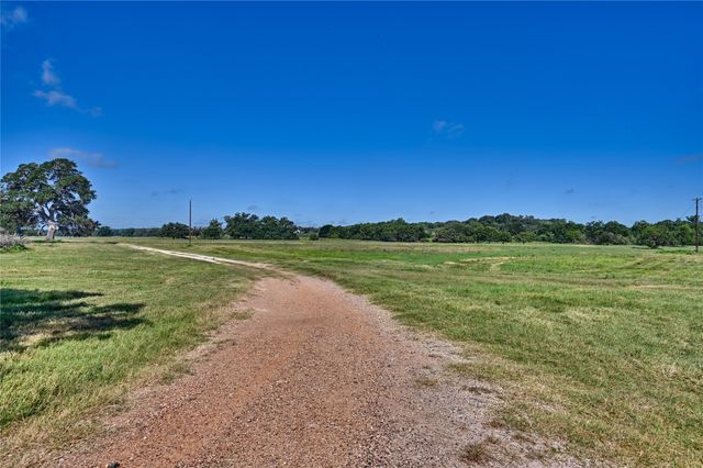 a view of a lake with houses in the back