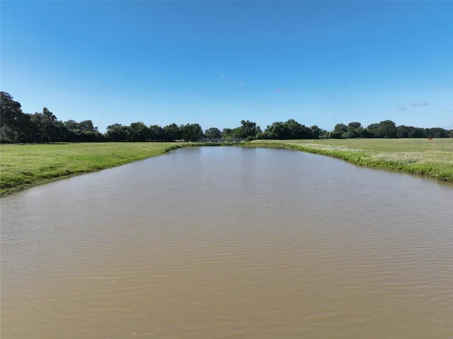 a view of a lake with a big yard