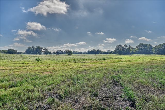 a view of a lake with a big yard