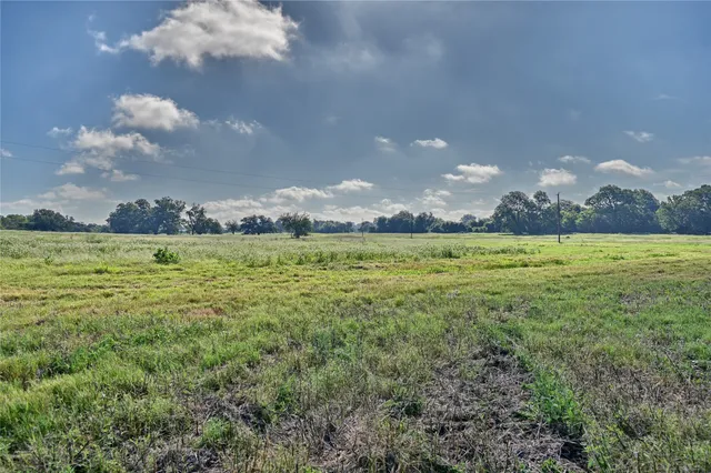 a view of a lake with a big yard
