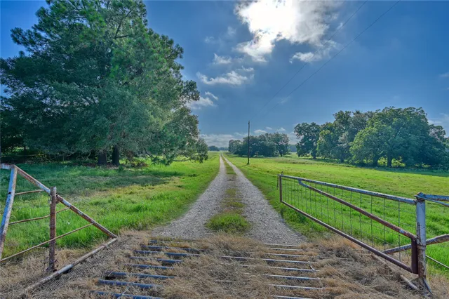 a view of a lake with a yard