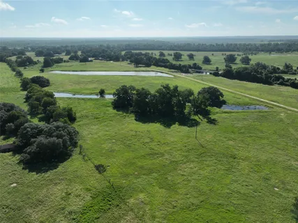 a view of a water fountain and a yard