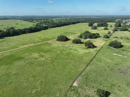 a view of a field with an ocean