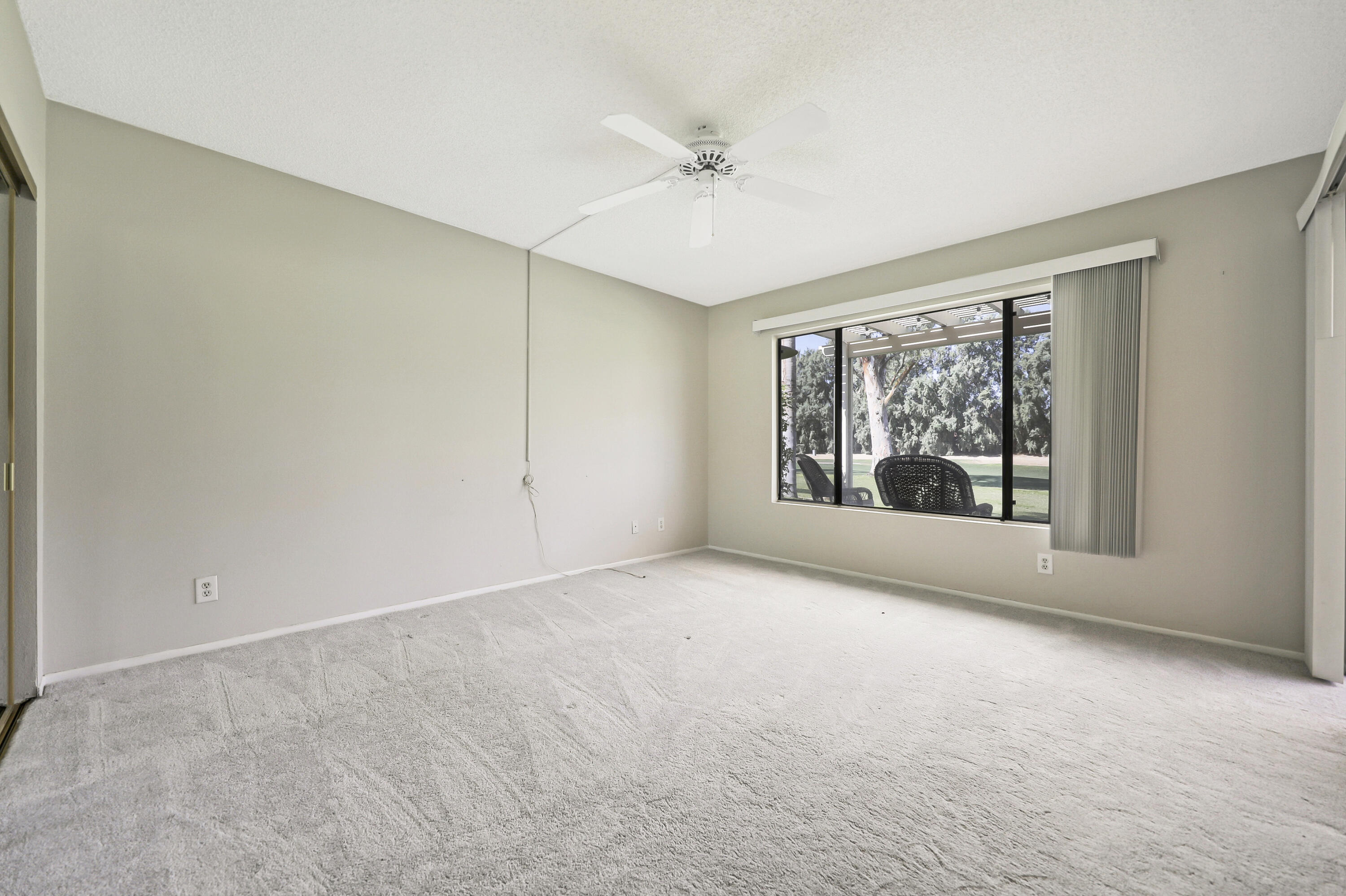 40953 Inverness Way Palm Desert, CA 92211 - Photo 4 of 41 a view of an empty room with a window