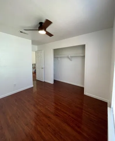 a view of a golf course with an outdoor space and seating