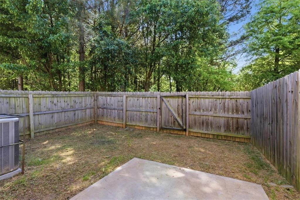 5064 Longview Walk Decatur, GA 30035 - Photo 5 of 30 a view of a backyard with wooden fence