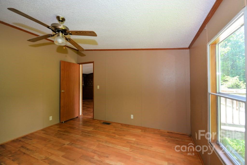 280 Lightning Bug Lane Waynesville, NC 28786 - Photo 17 of 26 a view of empty room with windows