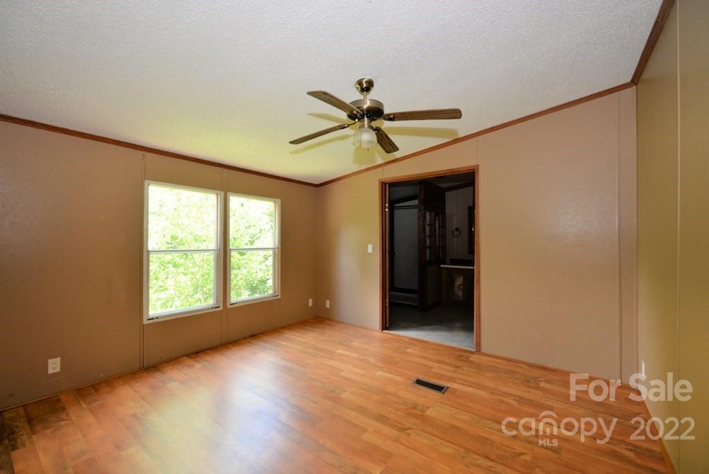280 Lightning Bug Lane Waynesville, NC 28786 - Photo 18 of 26 a view of an empty room with a window