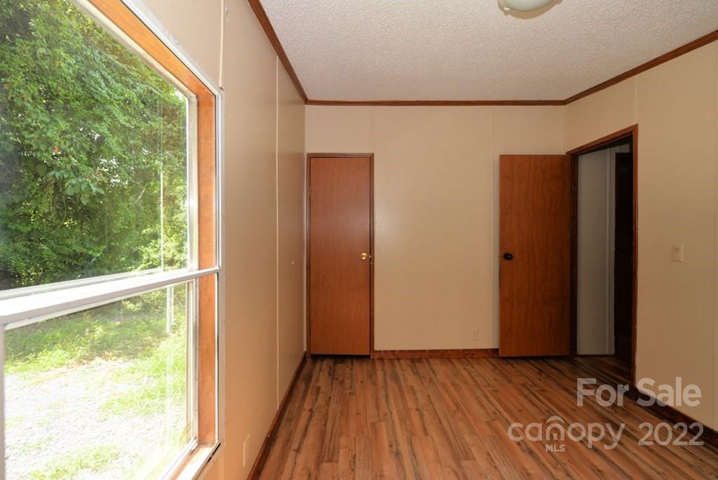 280 Lightning Bug Lane Waynesville, NC 28786 - Photo 10 of 26 a view of front door with wooden floor