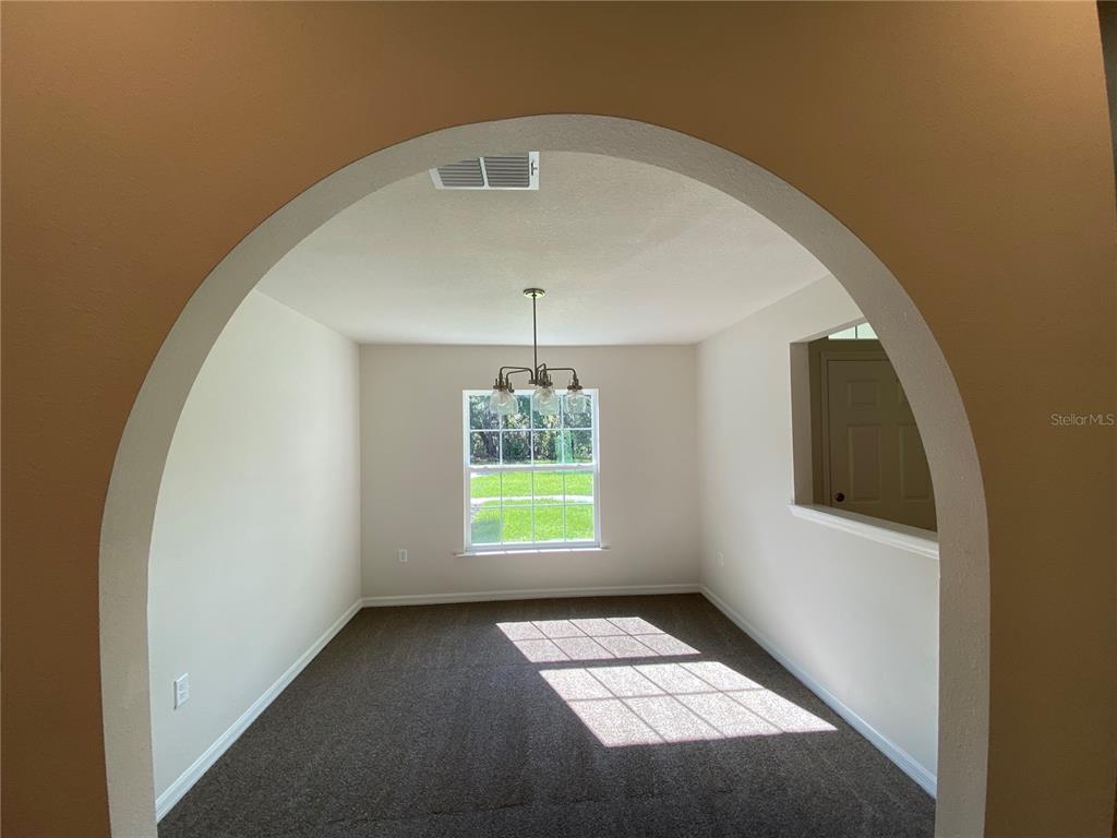 16090 Southwest 55th Avenue Road Ocala, FL 34473 - Photo 12 of 28 a view of an empty room with a window