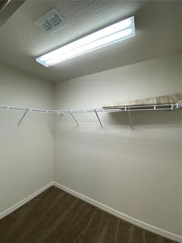a view of a room with racks on the wall