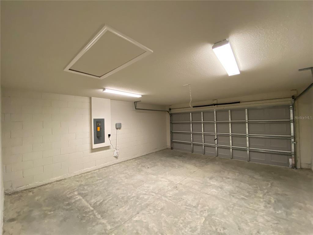 16090 Southwest 55th Avenue Road Ocala, FL 34473 - Photo 23 of 28 an empty room with a empty shelves and natural light