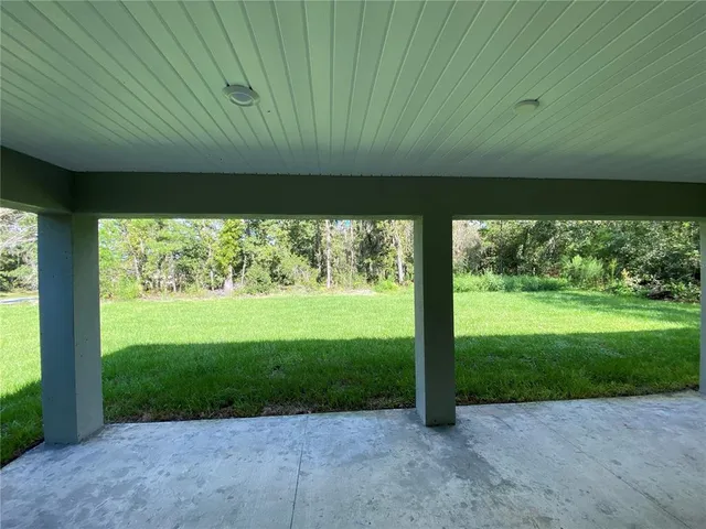 a view of a back yard from a room