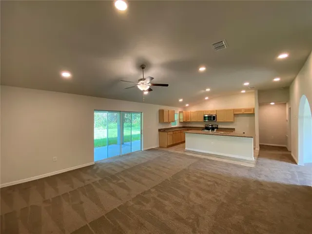 a view of a kitchen with a sink and a kitchen view