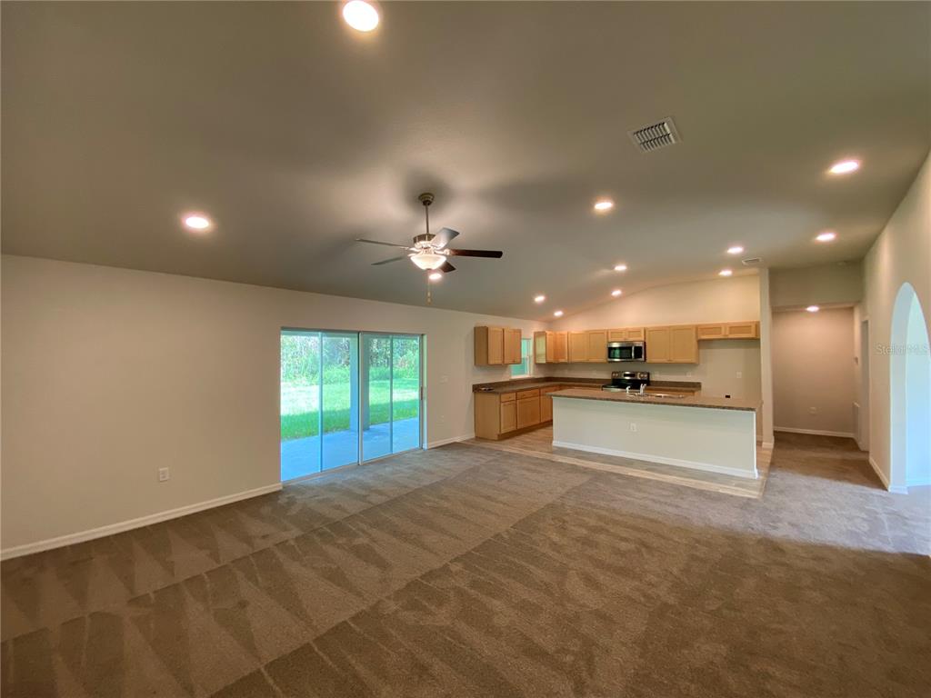 16090 Southwest 55th Avenue Road Ocala, FL 34473 - Photo 6 of 28 a view of a kitchen with a sink and a kitchen view