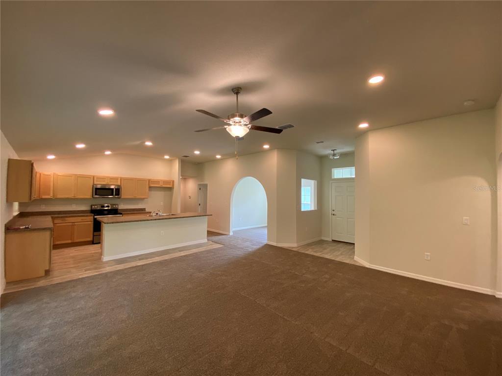 16090 Southwest 55th Avenue Road Ocala, FL 34473 - Photo 7 of 28 a view of a kitchen with a sink and a large window