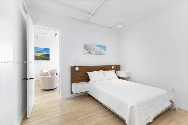 a bedroom with a bed and couch